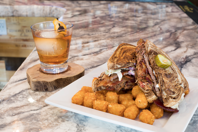 Served with a Bulleit Rye Old Fashioned, the Catcher's Rye sandwich of beef brisket, pork, candied whiskey bacon, beer cheese and slaw on marble rye. - Nicole Abbett