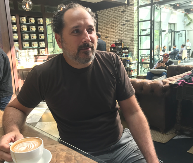 Warren Cockerham takes a coffee break while coordinating all aspects of the Florida Experimental Film/Video Festival. - BEN WILEY