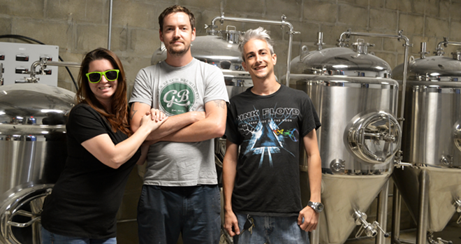 Overflow Brewing's Jessica Holder, Troy Bledsoe and Ryan Sarno in front of their shiny new equipment. - RYAN BALLOGG