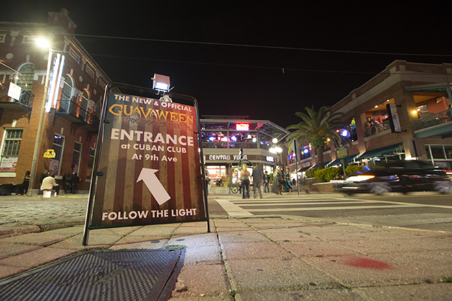 Signs around Ybor city directed participants to the "new and official"  Guavaween celebration. - Chip Weiner
