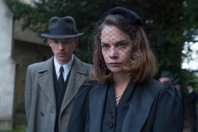 Caroline Ayres (Ruth Wilson, forefront) can't shake the feeling that some thing, or someone, might be haunting her. - Focus Features