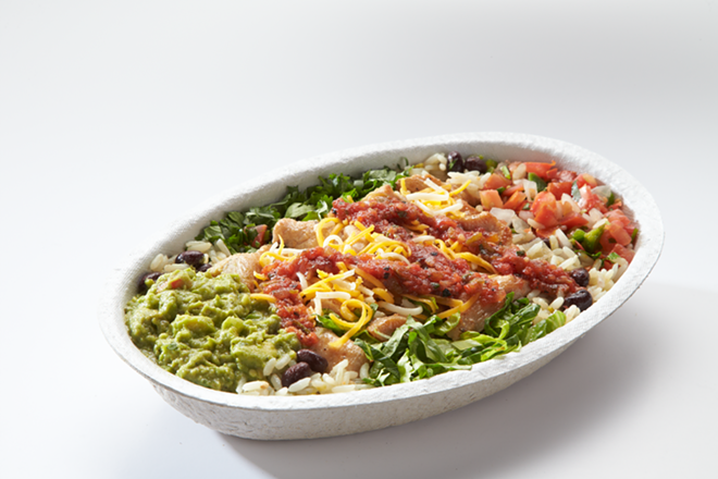 A salsa drizzle garnishes the franchise's fajita chicken burrito bowl. - Fuzzy's Taco Shop