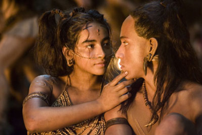VILLAGE PEOPLE: A tender moment is shared amid Apocalypto's thrilling chase story. - Walt Disney Pictures