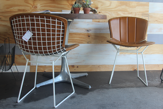 PARK IT HERE: Two chairs sourced by Chris Kelly with leather slips. - ALEXA ASENDORF