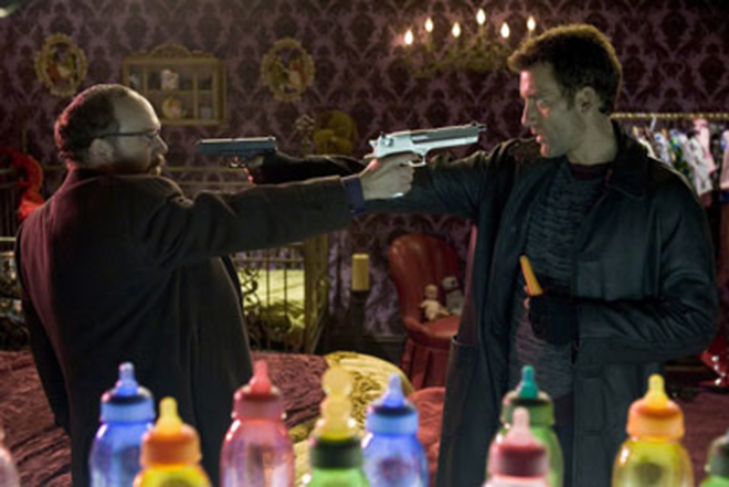 BARRELS OF FUN: Paul Giamatti and Clive Owen let their guns do the talking in Shoot 'Em Up. - New Line Cinema