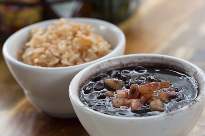 Bowls of the restaurant's black beans and Mexican rice. - Chip Weiner
