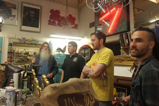 (From left to right) Evander Preston with Cigar City’s Justin Clark, Josh Brengle, and Ryan Stick at his studio in Pass-A-Grille. - ARIELLE STEVENSON