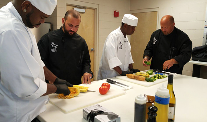 SPCC students Adrian Anthony and Ray Kennedy with chefs Tony Mangiafico and Jason Esposito. - Meaghan Habuda