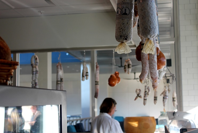 On the second floor, salumi and cheeses greet shoppers to their right. - Meaghan Habuda