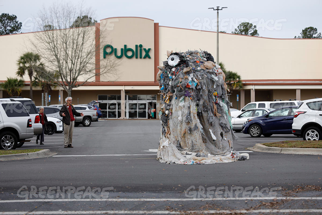 A 15-foot tall garbage monster is trying to shame Publix out of using plastic bags