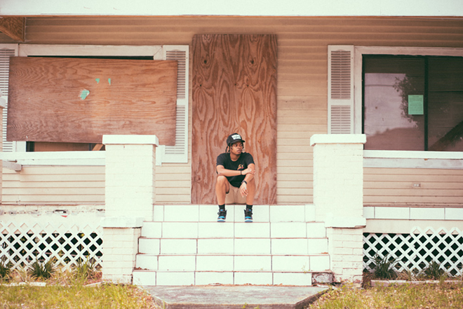 Jordan Patrick on the stoop of the Tampa, Florida home he grew up in. - Photo by Tyree Anderson (@sheepishnarco)
