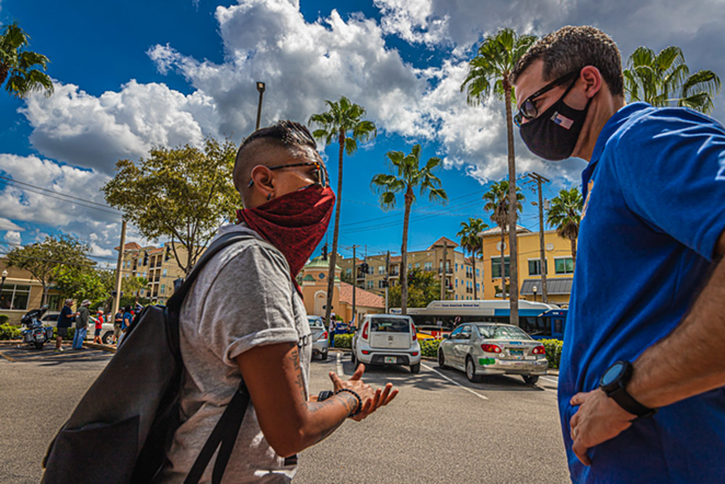 State Attorney Andrew Warren (right) talks with a protester outside CVS in Tampa, Florida on Sept. 19, 2020. - Dave Decker