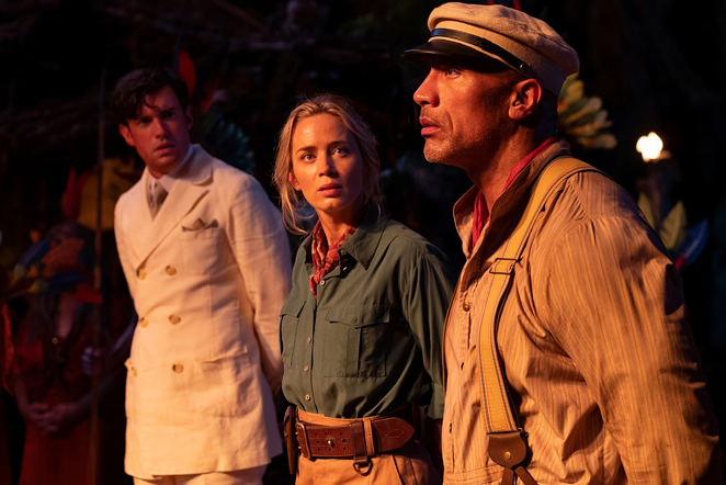 MacGregor (Jack Whitehall, left), Lily (Emily Blunt) and Frank (Dwayne Johnson) prepare to negotiate with some savage cannibals. - Frank Masi/Disney Enterprises, Inc.