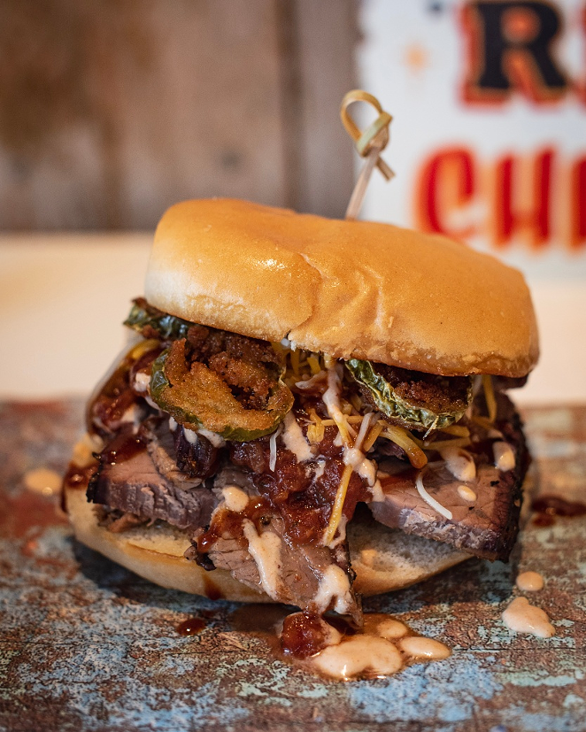 Q Southern Outpost's 'Texas Long Horn' sandwich with brisket, jack cheese, salsa, fried jalapeno, BBQ sauce and BBQ crema.