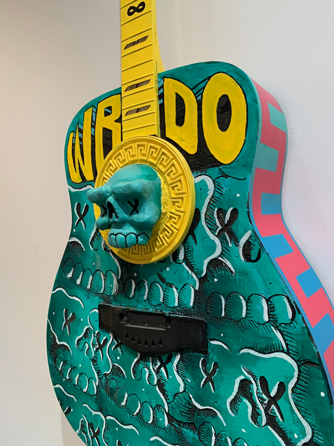A guitar by WRDO, hanging at the University of Tampa’s Ferman Center for the Arts.