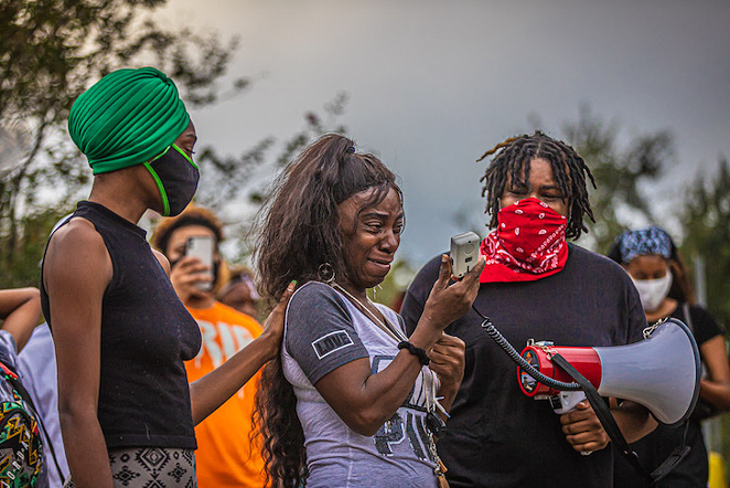 Activists with the mother of Dominique Mulkey who was killed by Tampa police on October 20, 2020. - DAVE DECKER