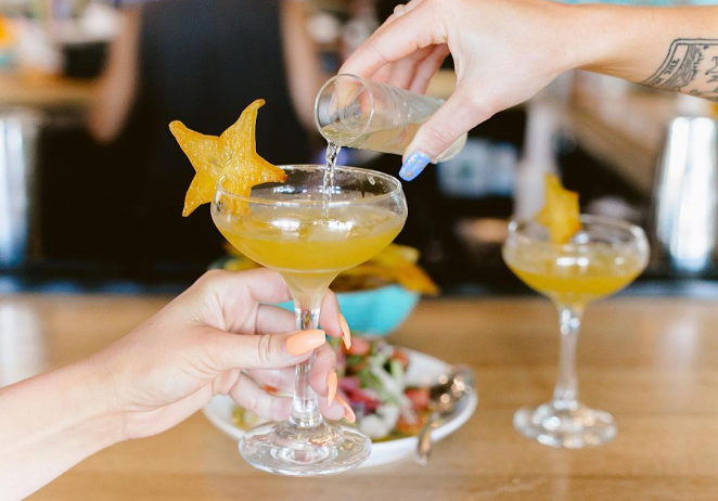 Wild Child's “porn star martini,” which fills an old fashioned coupe stem with vanilla vodka swirled with passion fruit liqueur and purée. - KRISTINA HOLMAN VIA WILD CHILD