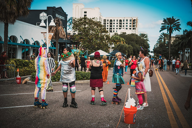 Sunshine City Roller Derby skaters engage with the community at last weekend's Central Avenue Halloween party in St. Petersburg, Florida. - Chandler Culotta