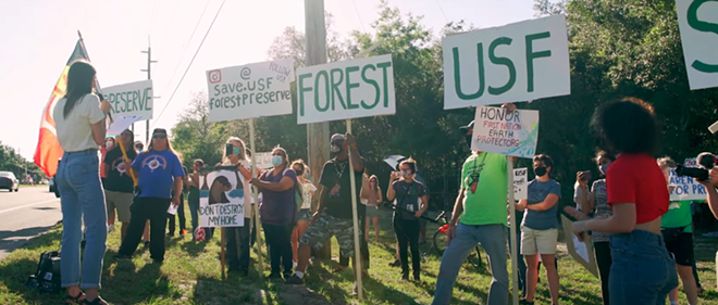 A crowd demonstrates in front of the USF Forest Preserve. - LUKE MYERS/YOUTUBE