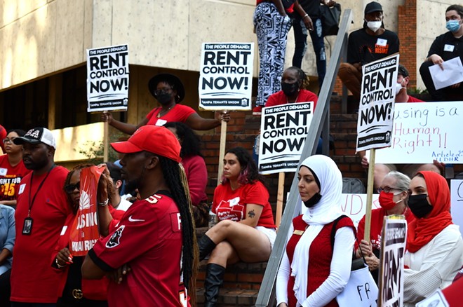 Protesters outside of Tampa City Hall call for rent control. - JUSTIN GARCIA