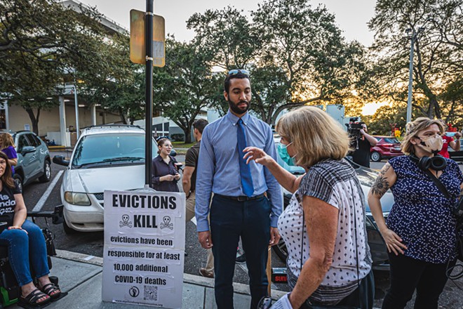 St. Petersburg City Councilman Richie Floyd speaks to a protester outside city hall in February 2022. - Photo by Dave Decker