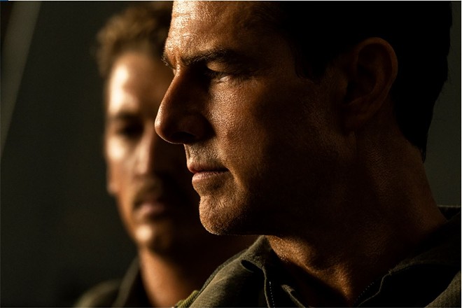 (L-R) Rooster (Miles Teller) has lived in the shadow of Maverick (Tom Cruise) for his entire life; thankfully, a nuclear threat will force them to not talk about their feelings while they fly to their possible doom. Also, summer blockbuster, yay! - PHOTO VIA PARAMOUNT PICTURES, SKYDANCE AND JERRY BRUCKHEIMER FILMS