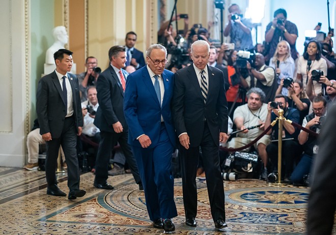 President Joe Biden, joined by Senate Majority Leader Chuck Schumer, D-N.Y., speaks to the press and departs the U.S. Capitol in Washington, D.C. on Wednesday, July 14, 2021, en route to the White House. - Official White House Photo by Adam Schultz