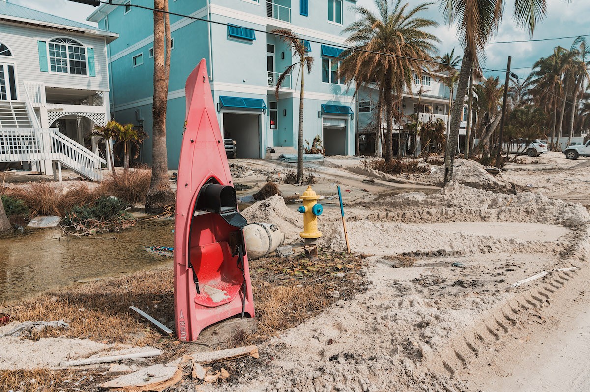 A mailbox fashioned out of an old kayak fits right in with its damaged surroundings in Bonita Beach, Florida. - Photo by Chandler M. Culotta