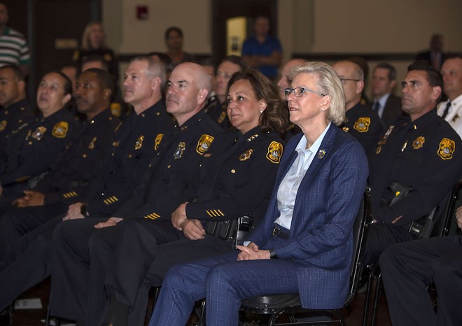 Tampa Police Chief Mary O'Connor sits next to Mayor Jane Castor (right) during Butch Delgado's retirement ceremony at the University of Tampa. - Kimberly DeFalco