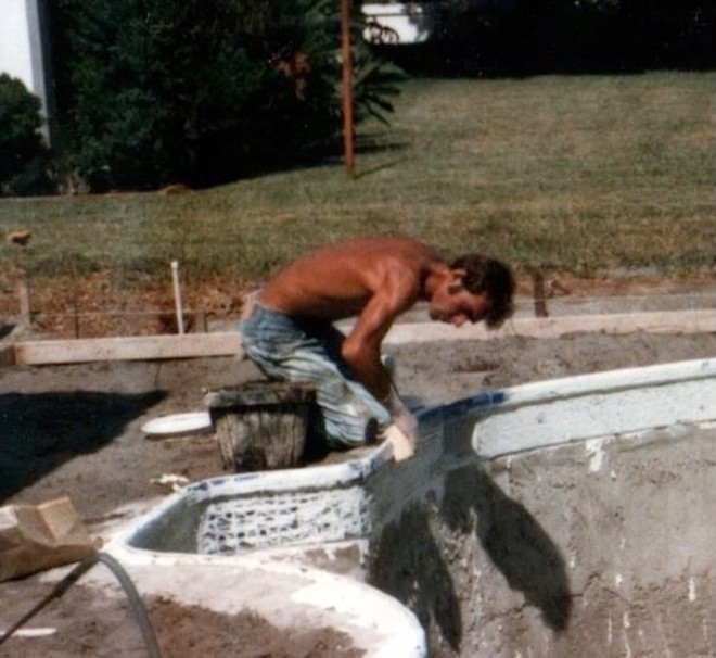 Albert H. Jones III of A.H. Jones Pools Inc. in Tampa, Florida, is seen in this undated photograph building a backyard pool. Jones, who died in 2010, was the contractor who built for his high school friend an unusual pool in Odessa, Florida, that is shaped like a Western-style, six-shooter revolver. - Fresh Take Florida/Photo courtesy of Travis Jones