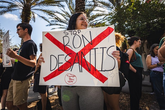A protestor holds a sign at a recent rally for academic freedoms at USF. - Dave Decker