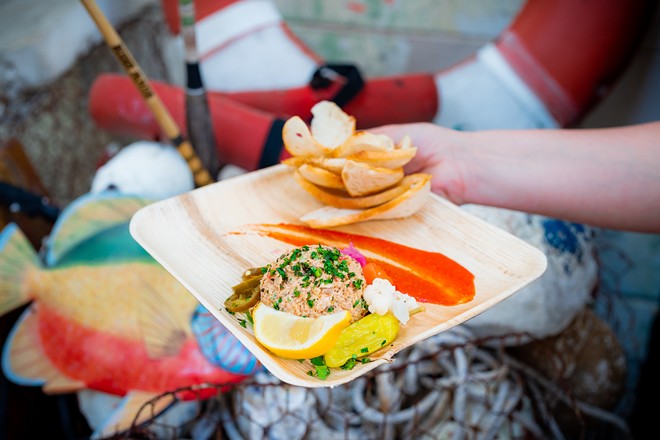 Trophy Fish menu favorites include its grouper sandwich, house made fish spread (pictured), smoked shrimp, and a seafood boil for two. - Photo via c/o Seed & Feed Hospitality
