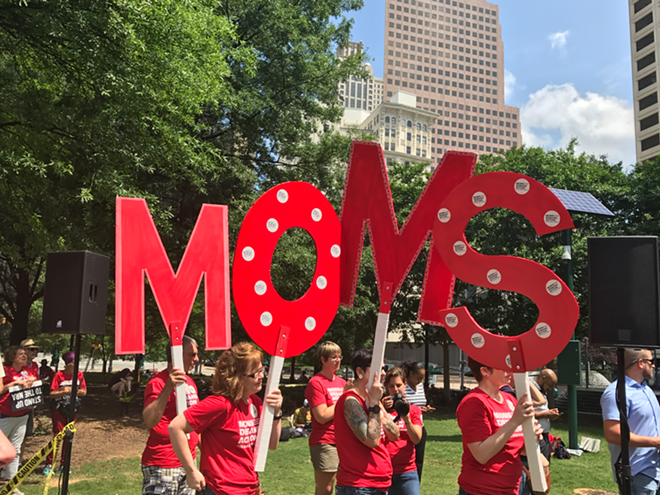 Activists from Moms Demand Action, an organization that pushes for tougher gun laws. - Elizabeth Randall