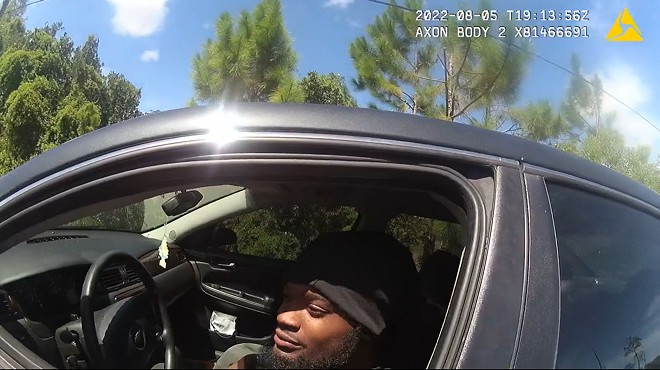 In a screenshot from a sheriff's body camera video, Darius Jermaine Ned Thomas Jr., 22, of Jacksonville, Florida, leans out his driver's window Aug. 5, 2022, to accept a $114 ticket from Jacksonville Sheriff's Office deputy M.L. Albert for playing his music too loudly. Black drivers, like Thomas, are nearly three times as likely as white ones to be ticketed under the law, according to a new investigation by the University of Florida College of Journalism and Communications. - Screenshot via Fresh Take Florida/Jacksonville Sheriff's Office