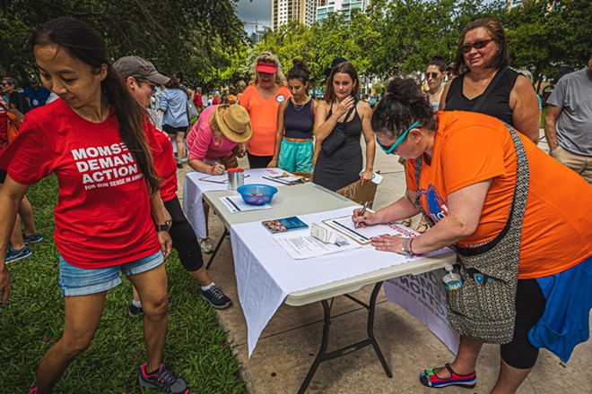 A Moms Demand Action table in St. Petersburg's Straub Park on June 11, 2022. - Photo by Dave Decker