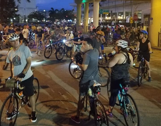 While the cops have rules for riding bikes at night (read: lights), Critical Mass Tampa Bay only has one: no gaps. - Photo via CriticalMassTampaBay/Facebook