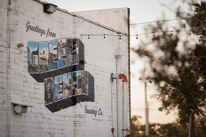 The late Matt Callahan's Green Bench postcard mural. - Photo via cityofstpete/Flickr