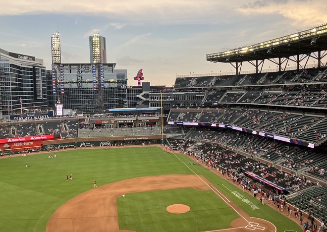 Truist (previously SunTrust) Park is postmodern throwback. Brick facade, steel girders, hunter green seats. All the trappings of an authentic stadium, with a cup holder for every fan. - Photo by Thomas Hallock