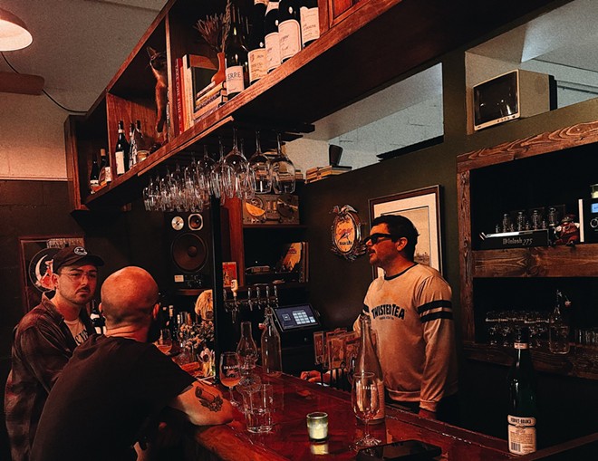 Seth Davis bartends at one of Small Bar's opening weekends. - Josh Weaver