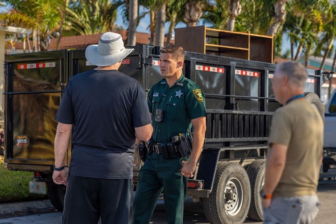 A Pinellas sheriff officer speaking to residents. - sheriffpinellas/Twitter