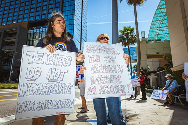 Brandt Robinson (L) outside Moms For Liberty's national summit outside the Water Street Marriott in Tampa, Florida on July 15, 2022.
