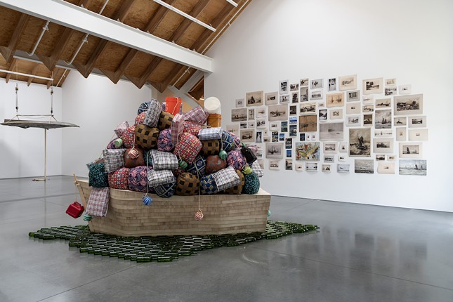 Barthélémy Toguo (Came
roonian, b. 1967)

Road to
Exile
, 2018

Wooden boat, cloth bundles, glass
bottles, and plastic containers

120 x 60 x 45 inches

Jorge M. Pérez Collection, Miami