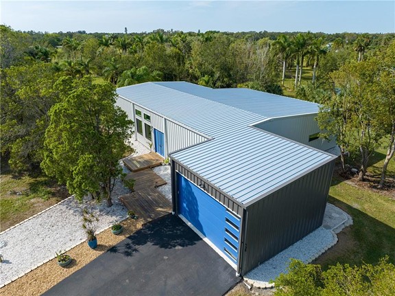 This Tampa Bay warehouse home comes with an 8,000 gallon koi pond and a dog-washing station