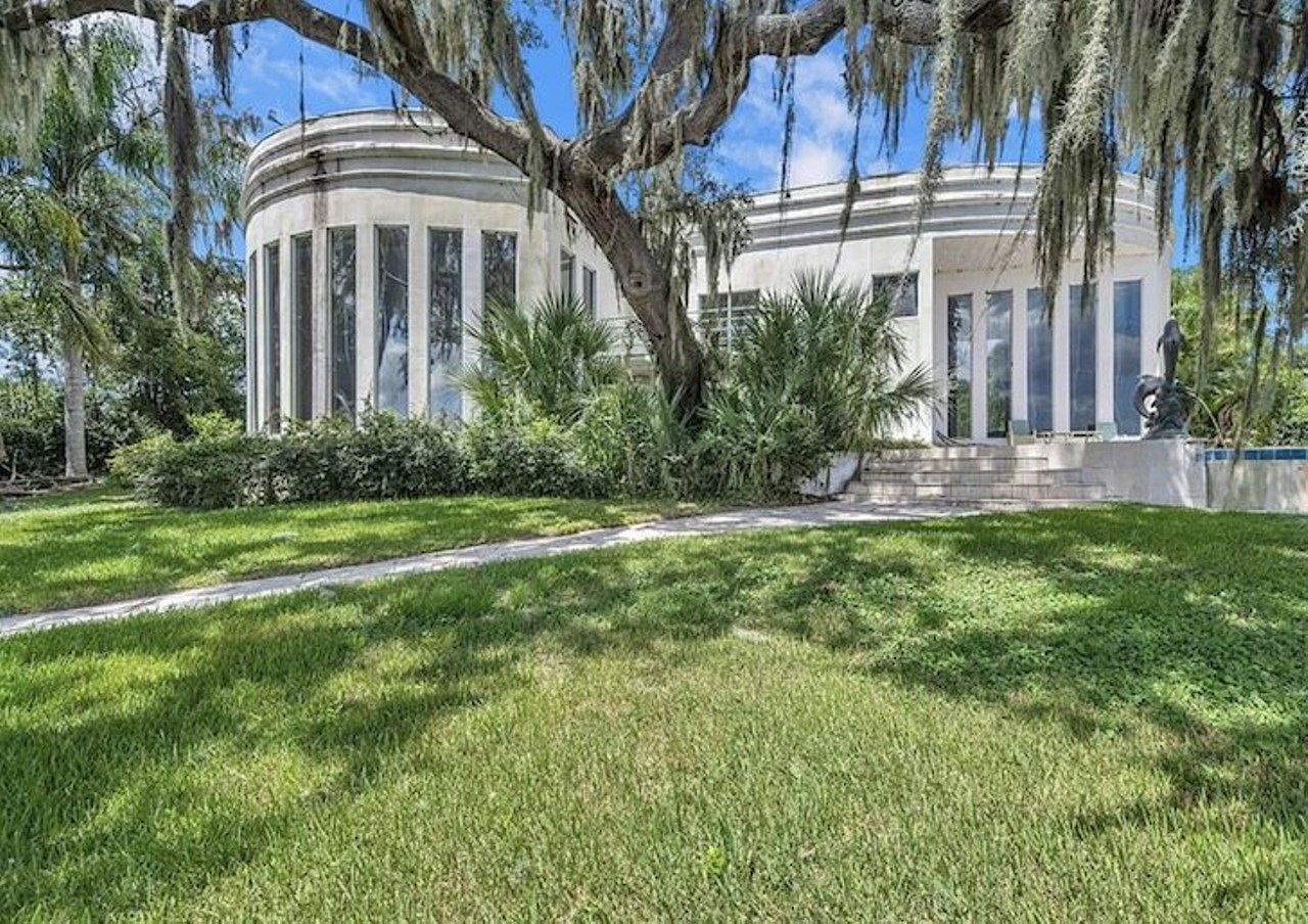 The former mansion of a Tampa police officer arrested in a cocaine sting is now for sale