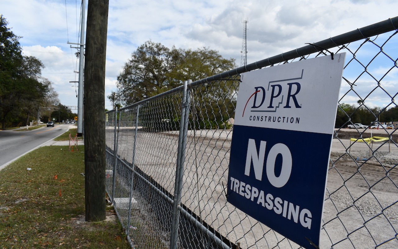 A DPR Construction sign sits on the fence surrounding the Hanna Avenue project in 2021.