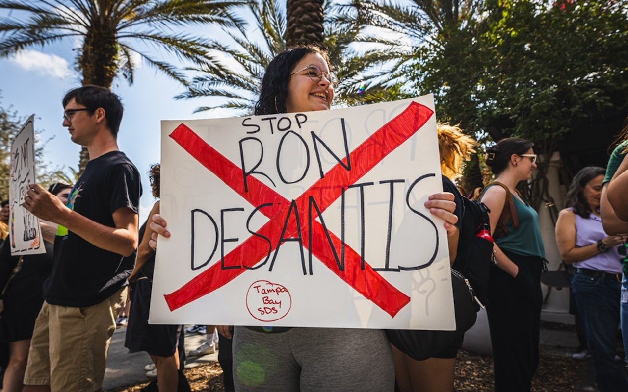 A protestor holds a sign at a recent rally for academic freedoms at USF.