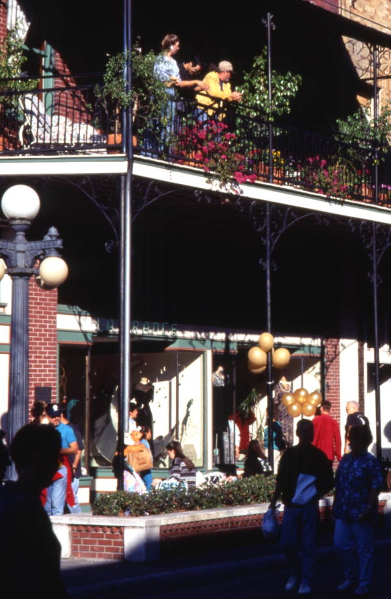 People strolling by the La France clothing store on Fiesta Day in Ybor City (1969).