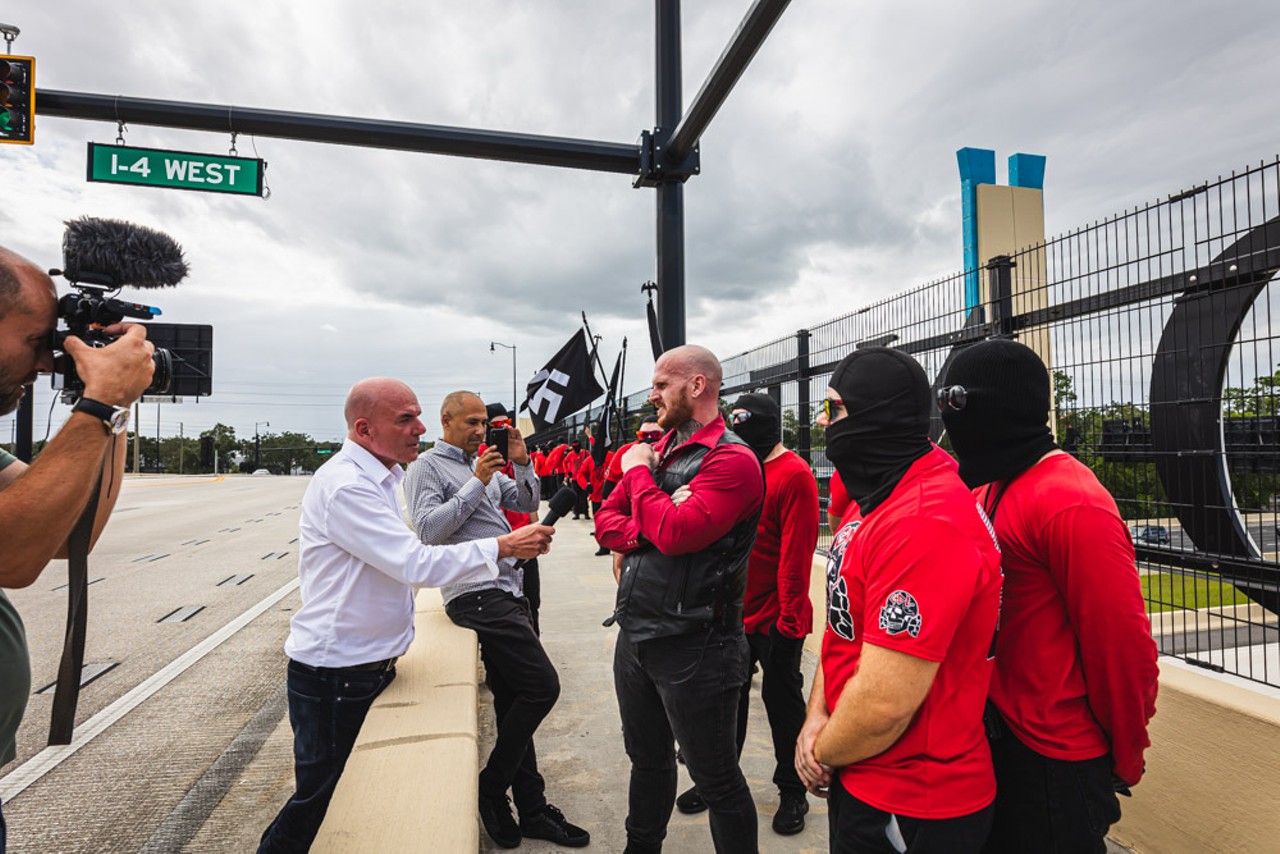 'We are everywhere': Multiple neo-Nazi groups carrying swastika and DeSantis flags march through Orlando [PHOTOS]