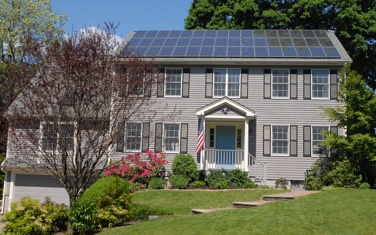 A house with rooftop solar in Massachusetts, the Sunshine State. Wait, what?