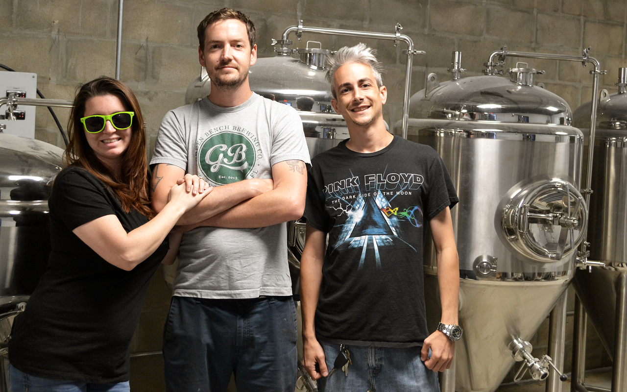 Overflow Brewing's Jessica Holder, Troy Bledsoe and Ryan Sarno in front of their shiny new equipment.